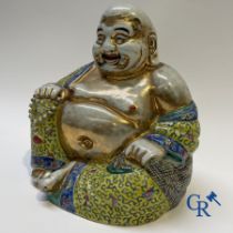 Chinese porcelain: Tall figure of Buddha.