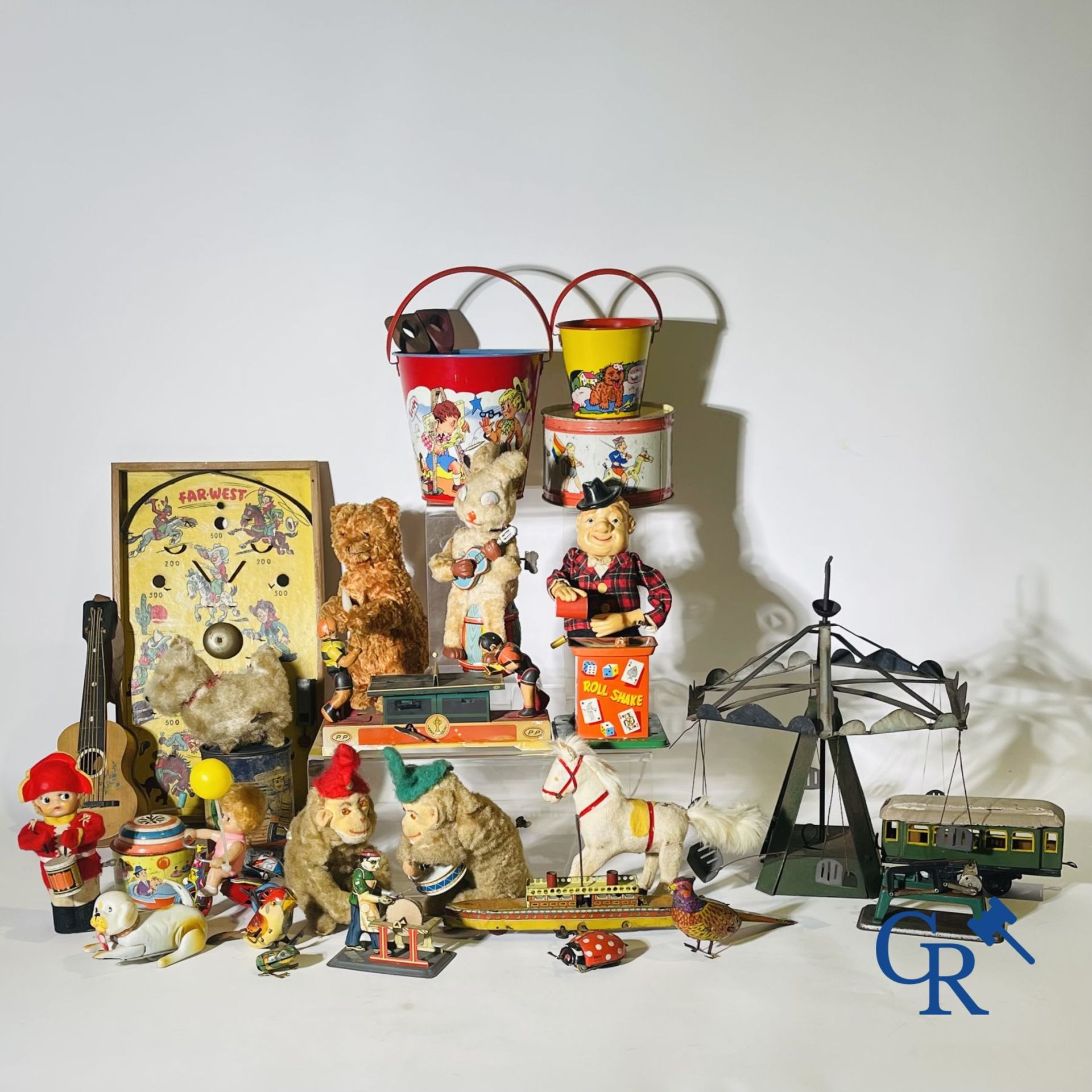 Toys: Large lot mechanical and tin toys.