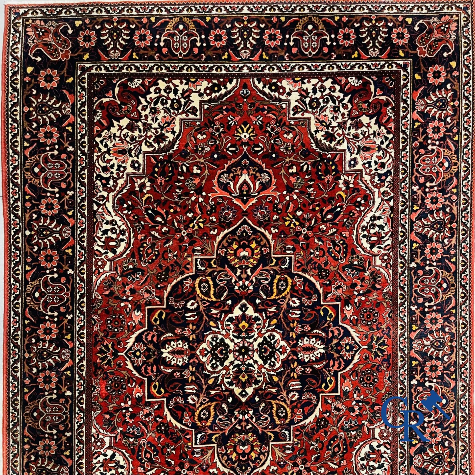 Oriental carpets: Iran. Large Persian hand-knotted carpet with floral decor.