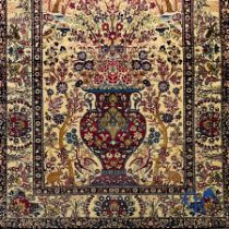 Oriental carpets. Iran. Persian carpet with a flower vase, birds and rabbits in a floral decor.