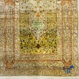 Oriental carpets: An exceptionally signed carpet in silk and gold thread with verses and a floral de