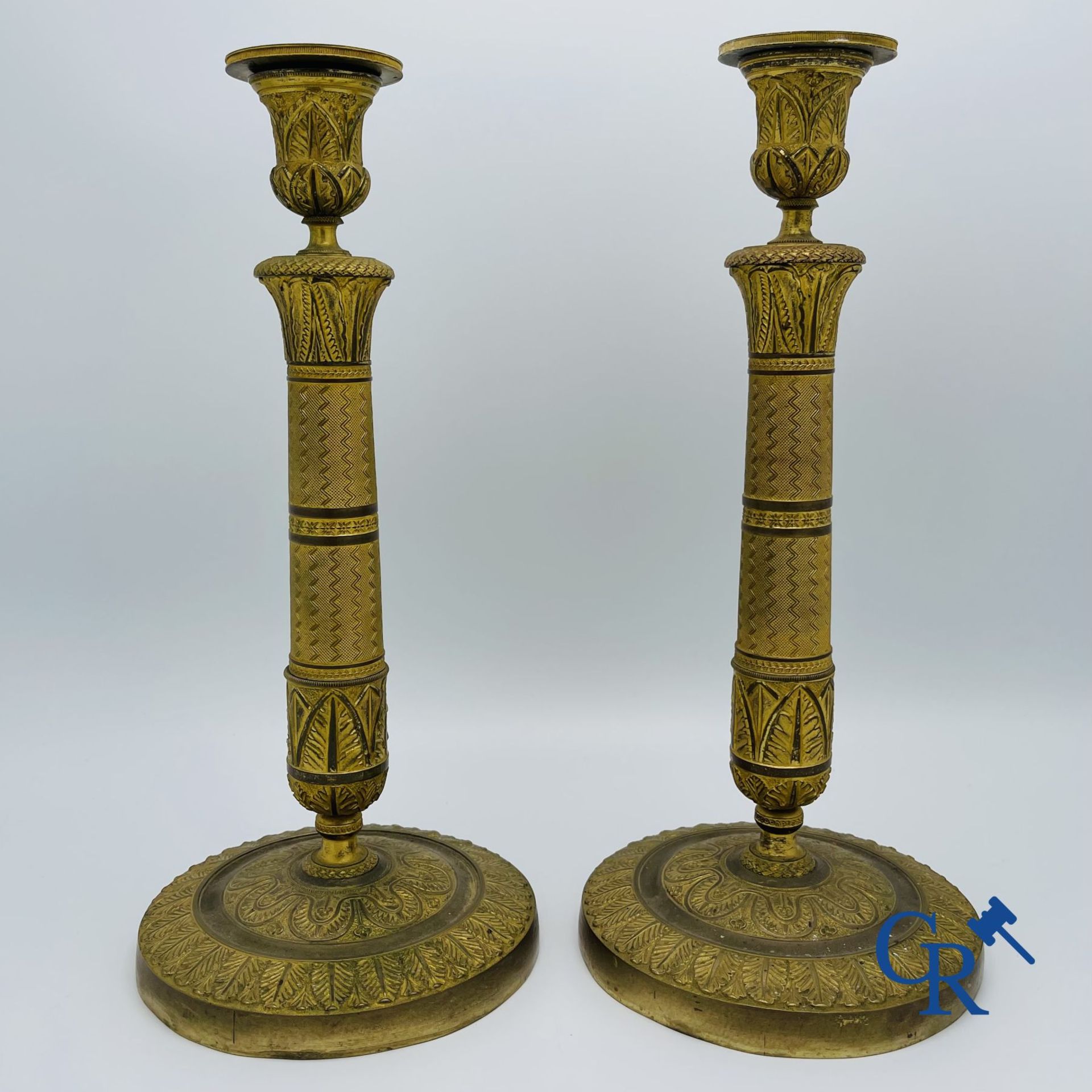 Pair of Charles X candlesticks in gilded bronze.