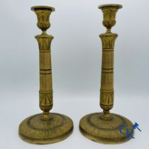 Pair of Charles X candlesticks in gilded bronze.