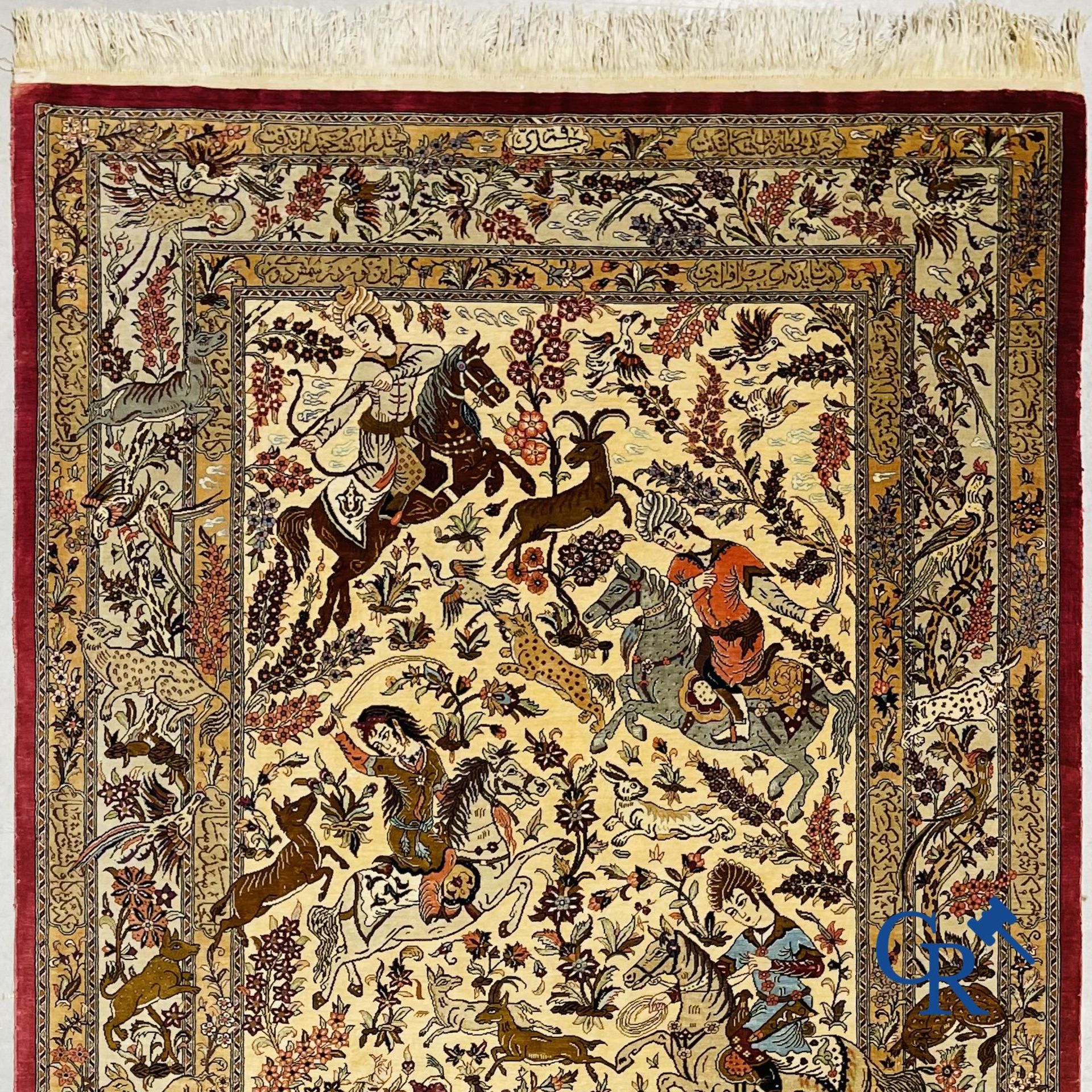 Oriental carpets: Iran, Ghoum. Signed Persian carpet in silk with a hunting decor.