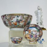 A large Chinese famille rose mandarin bowl, a famille rose cup and saucer and a figurine in blanc de