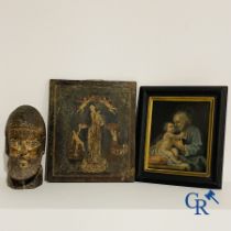 2 religious paintings and a wooden sculpted head of a saint.
19th century.