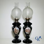 Pair of oil lamps in black opaline with enamelled decor.