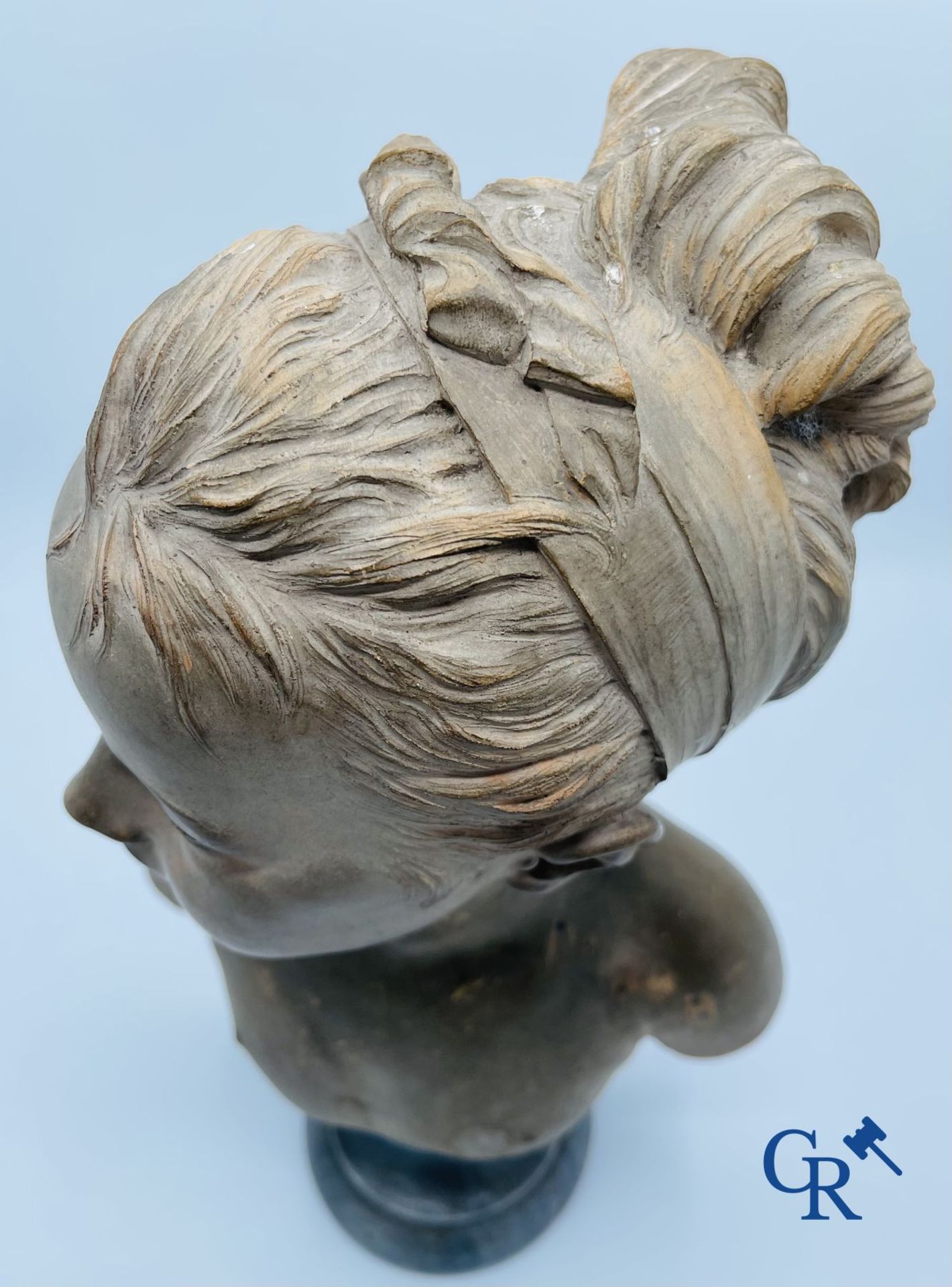 A bust in terre cuite on a blue gray marble pedestal. 19th century. - Image 5 of 8