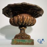 A 19th century cast iron garden vase decorated with grapevines.