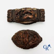 Display case objects: 2 pill boxes in sculpted corozo walnut.