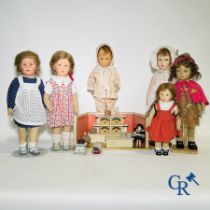 Toys: antique dolls: a lot of 6 dolls with a miniature grocery store attached.