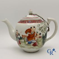 Asian Art: Chinese teapot in famille rose porcelain with a decor of playing children.