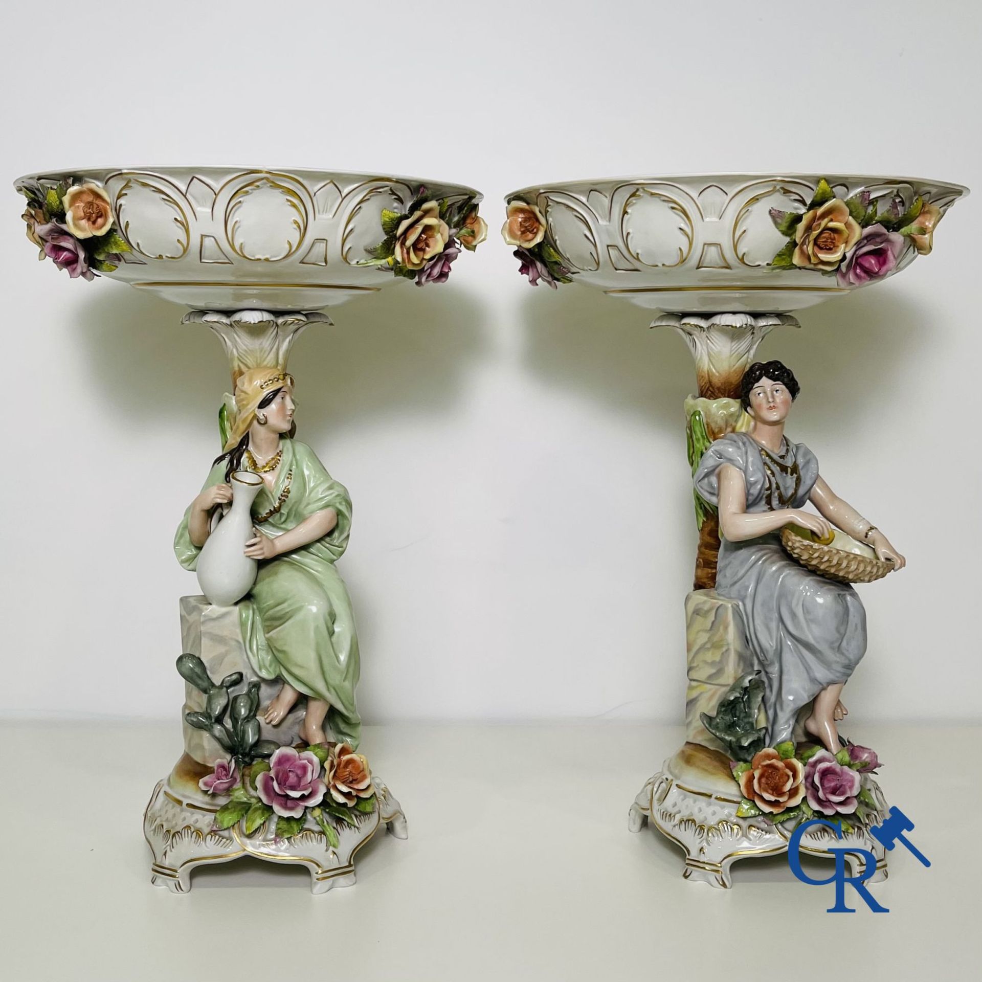 A pair of table centrepieces in German polychrome porcelain.