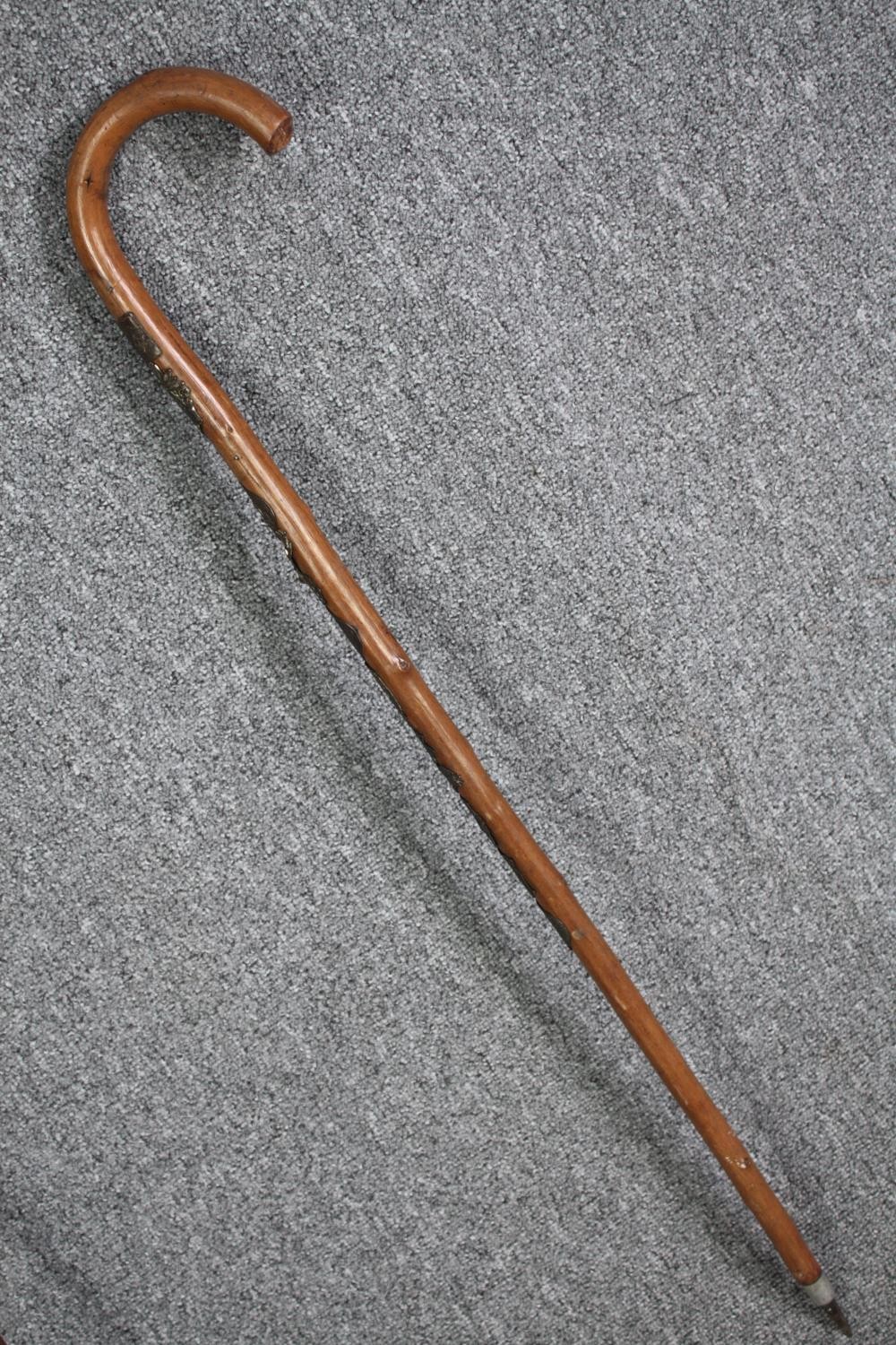 A pair of walking canes. The smaller one with a bone and silver handle the other, German and - Image 5 of 7