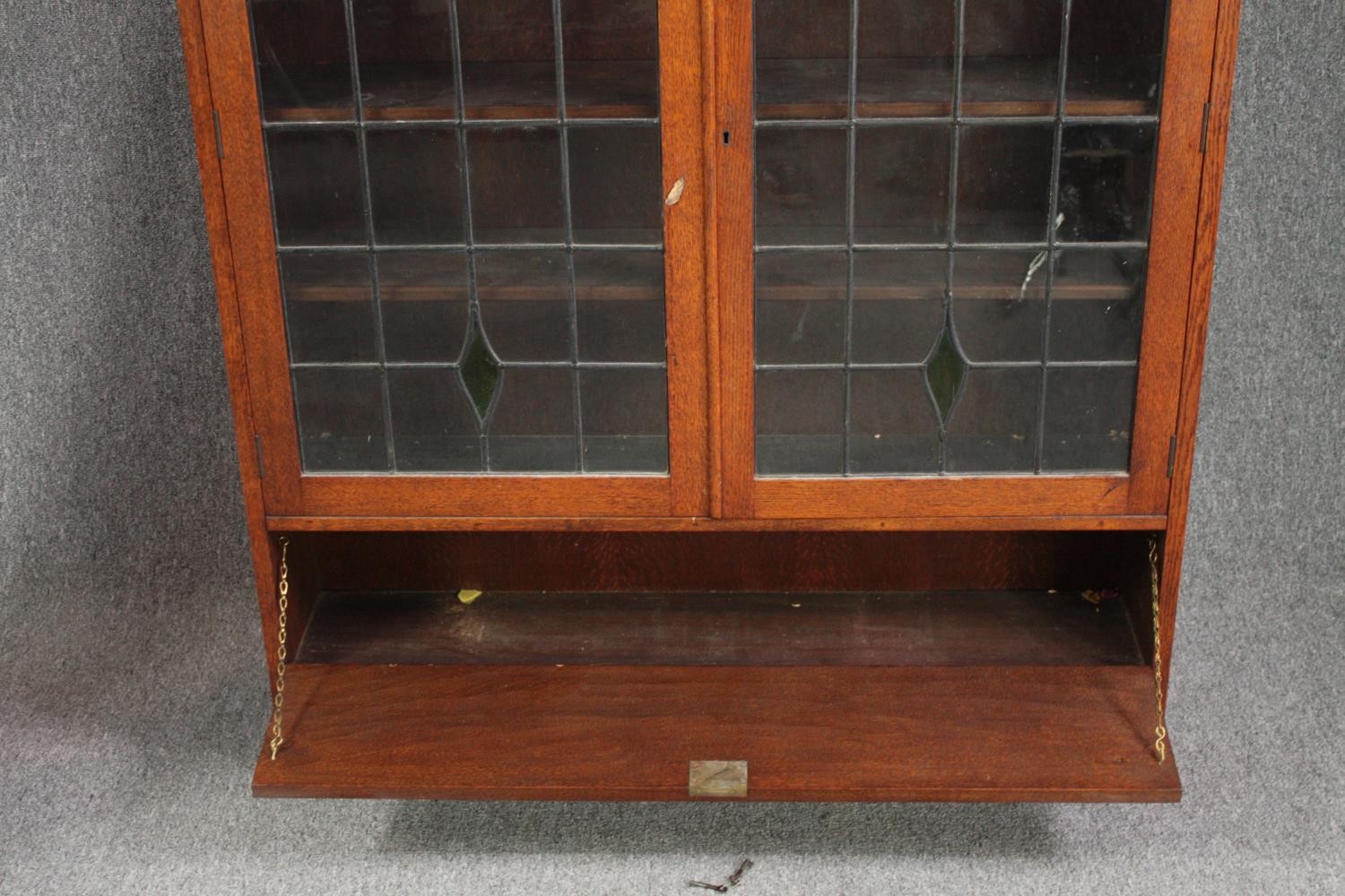 Bookcase, mid century oak with leaded and coloured glass doors. H.137 W.107 D.24cm. - Image 8 of 8