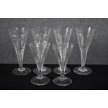 Six stemmed conical glasses. A set of four and a pair with etched decoration. H.17cm. (largest)