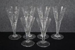 Six stemmed conical glasses. A set of four and a pair with etched decoration. H.17cm. (largest)