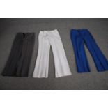 Three pairs of bespoke made vintage flared trousers in various colours.