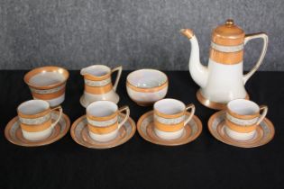 Noritake coffee set made up of four cups and saucers, a creamer, coffee pot and two sugar pots. H.