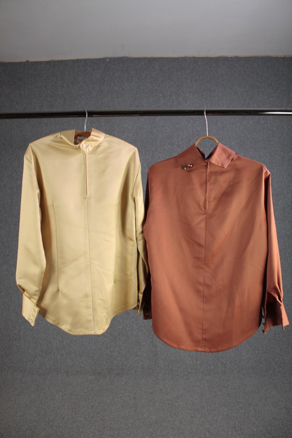 Two bespoke made silk shirts, one salmon and one gold with mother of pearl buttons.