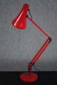An Anglepoise lamp in red. Probably made in the 80s. H.83 cm.