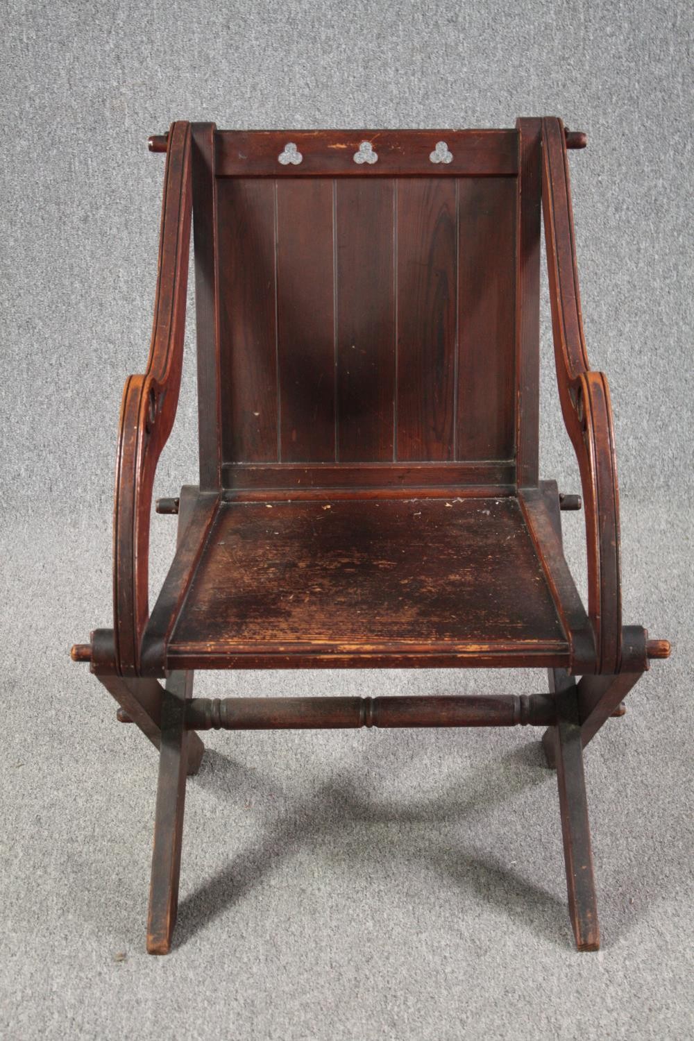 Glastonbury chair, 19th century pitch pine Gothic style. H.90cm.