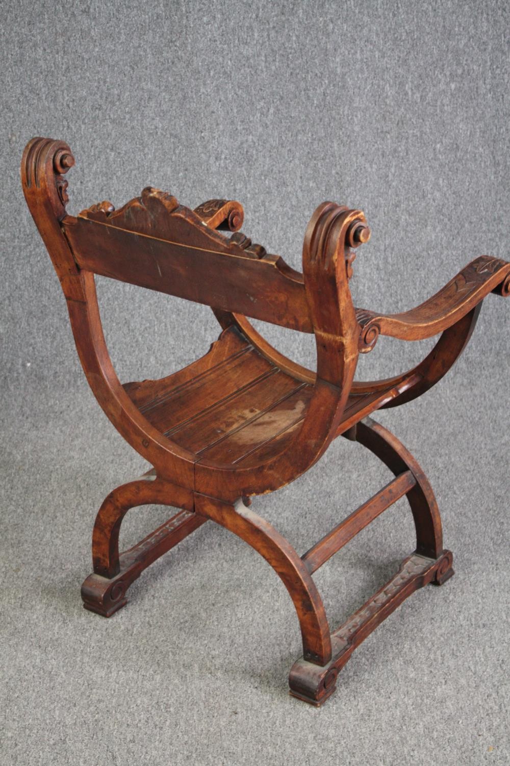 A 19th century carved walnut Savonarola chair. H.85 W.62cm. - Image 4 of 6