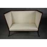 An Edwardian mahogany framed high back canape reupholstered in ivory fabric. H.106 W.137 D.62cm.
