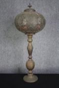 A brass Ottoman candlestick converted into a lamp. H.80cm.