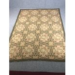 A hand woven carpet or wall hanging with Aubusson style floral weave across the field. L.286 W.217