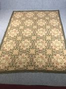 A hand woven carpet or wall hanging with Aubusson style floral weave across the field. L.286 W.217