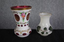 Two milk glass vases with gilt edging and floral decoration. One Bohemian cameo glass with cranberry