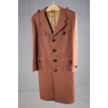 A vintage tailor made silk mix overcoat with maker's label.
