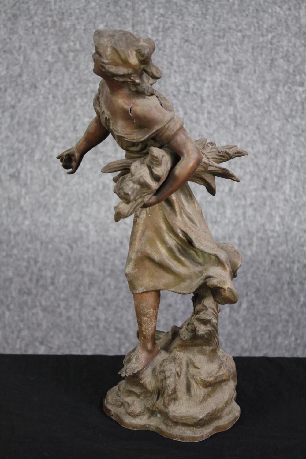 A metal figure. Probably early twentieth century. A women sowing seeds. With some damage to the - Image 3 of 5