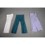 Three pairs of bespoke made vintage flared trousers in various colours.