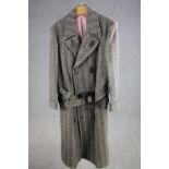 A vintage bespoke made silk lined herringbone tweed long overcoat with statement buckle.
