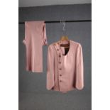 A vintage bespoke made pink silk mix suit with flared bottoms.