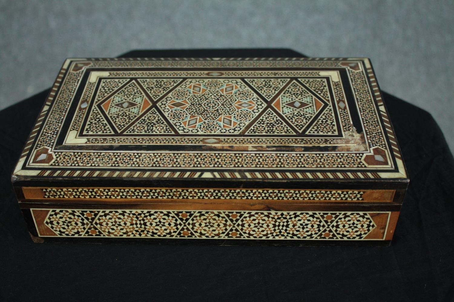 A 19th century bone and marquetry damascene micro mosaic Islamic jewellery box. H.7 W.25 D.15cm. (