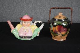 A nineteenth century Staffordshire 'Peg Leg' Toby Jug teapot and a lusterware lidded pot. The