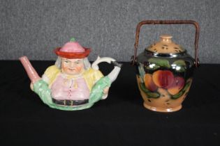 A nineteenth century Staffordshire 'Peg Leg' Toby Jug teapot and a lusterware lidded pot. The