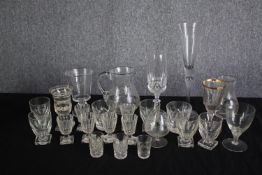 An assortment of mixed glass. Including sherry, wine and shot glasses and two jugs. H.28cm. (