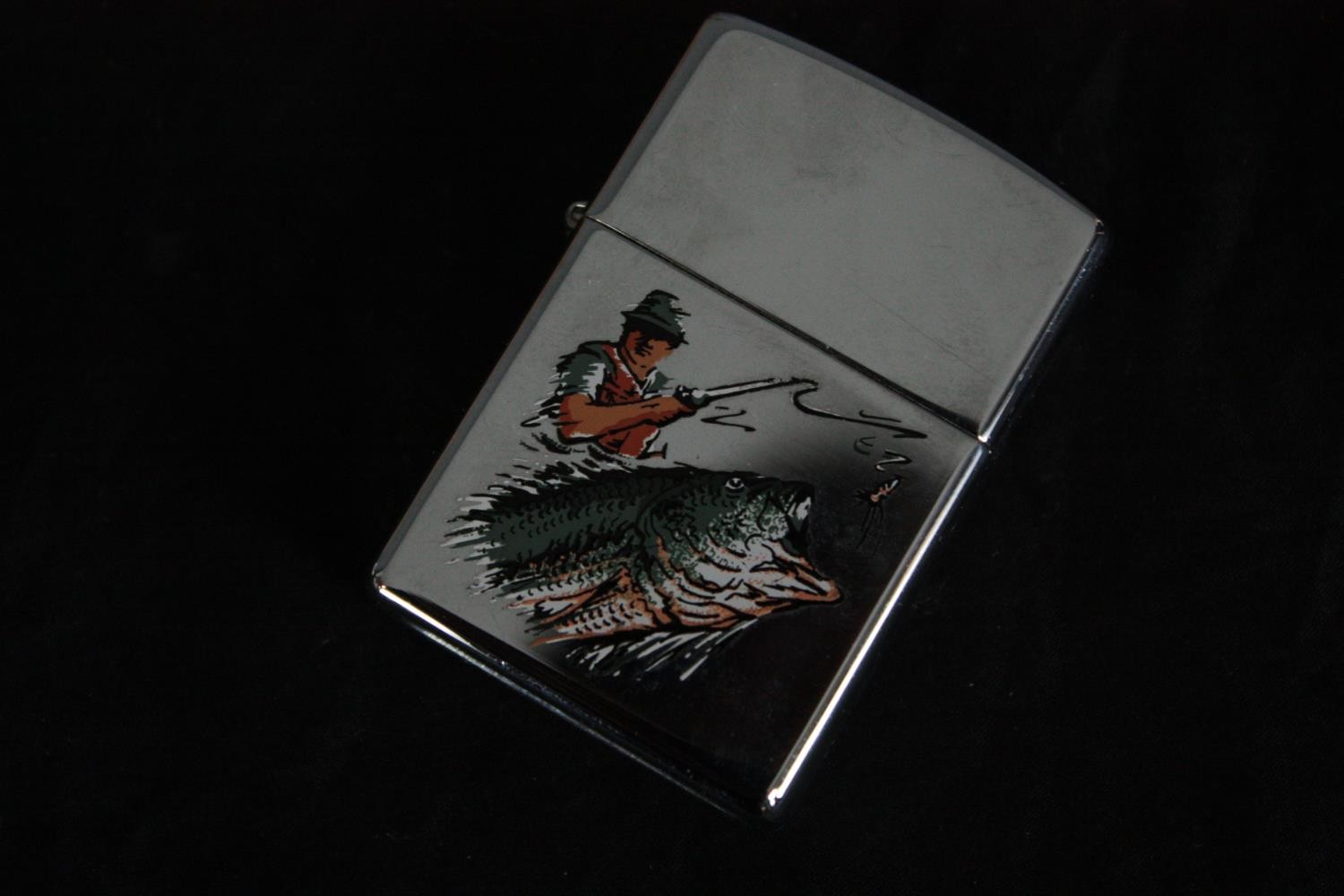 A miscellany. Two books on fishing and game hunting, a Zippo lighter and fish ornaments. H.22 W. - Image 3 of 11