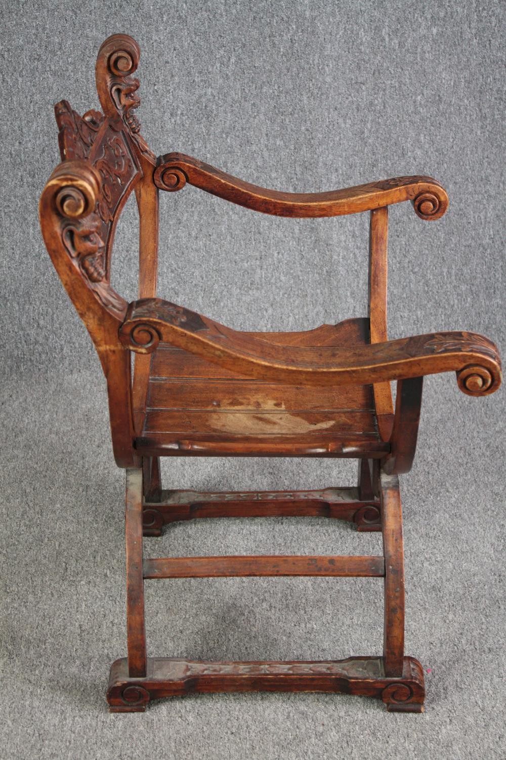 A 19th century carved walnut Savonarola chair. H.85 W.62cm. - Image 3 of 6