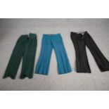 Three pairs of bespoke made vintage flared trousers in various colours.