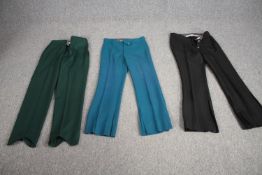 Three pairs of bespoke made vintage flared trousers in various colours.