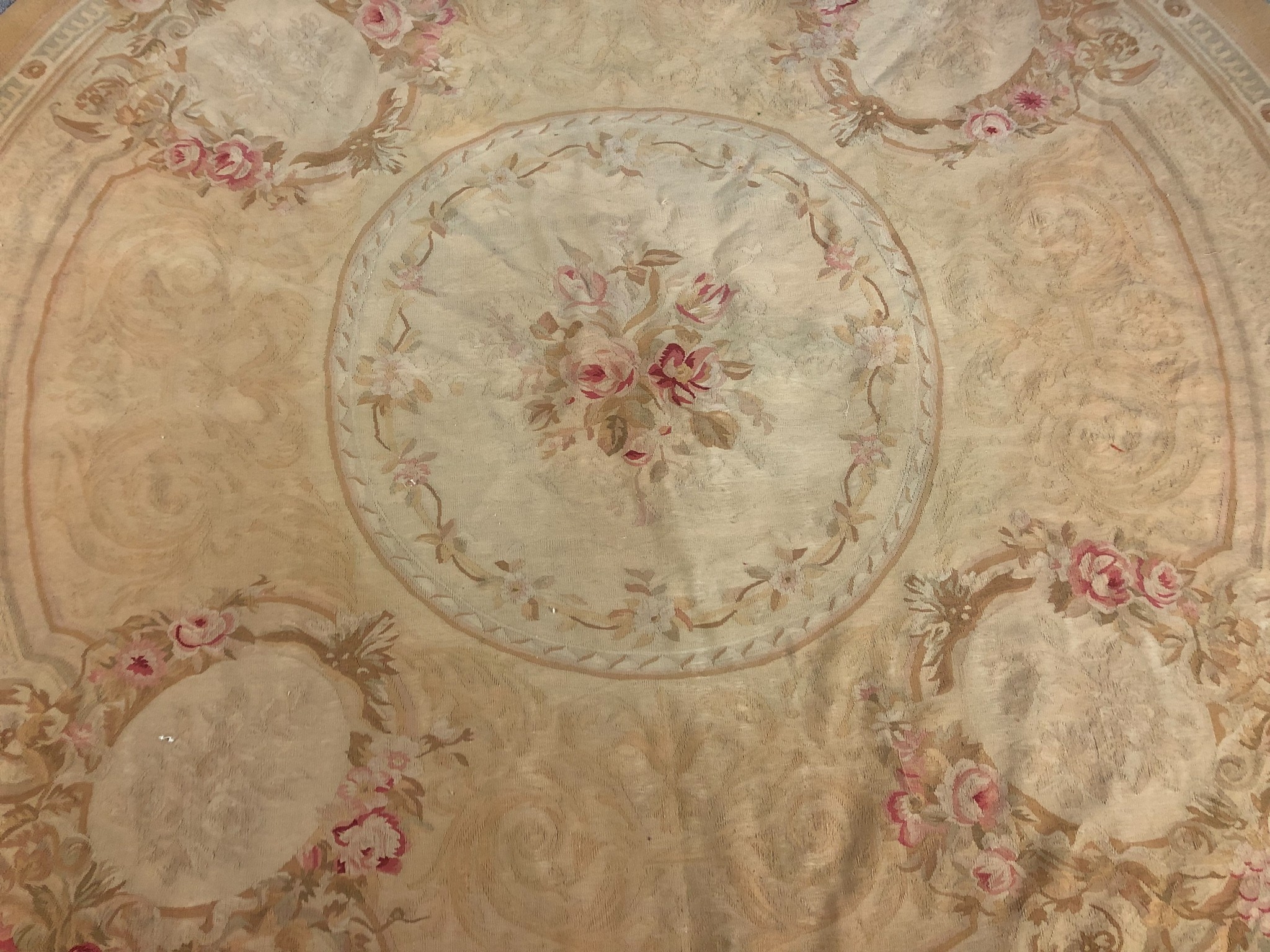 A hand woven Aubusson style rug with floral spray medallions on a beige ground. Dia.240cm. - Image 2 of 4