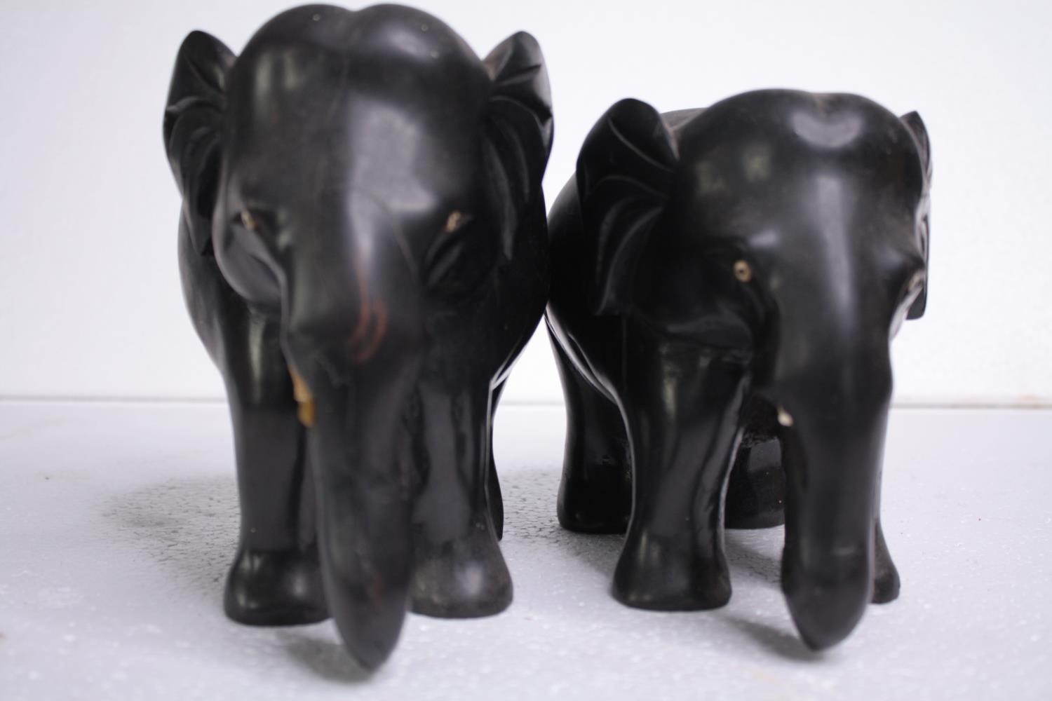 Two carved ebony elephants. Missing their tusks. Early to mid twentieth century. H.15 W.18cm. ( - Image 6 of 6