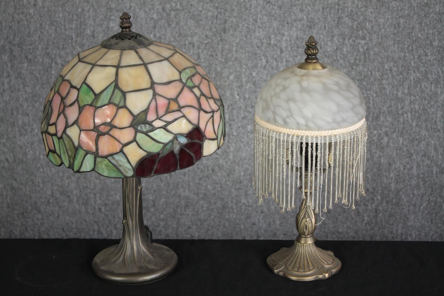 Two tables lamps. A Tiffany style lamp and another with a drop bead shade. H.29cm. (largest)