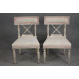 A pair of 19th century painted dining chairs in the Gustavian style.