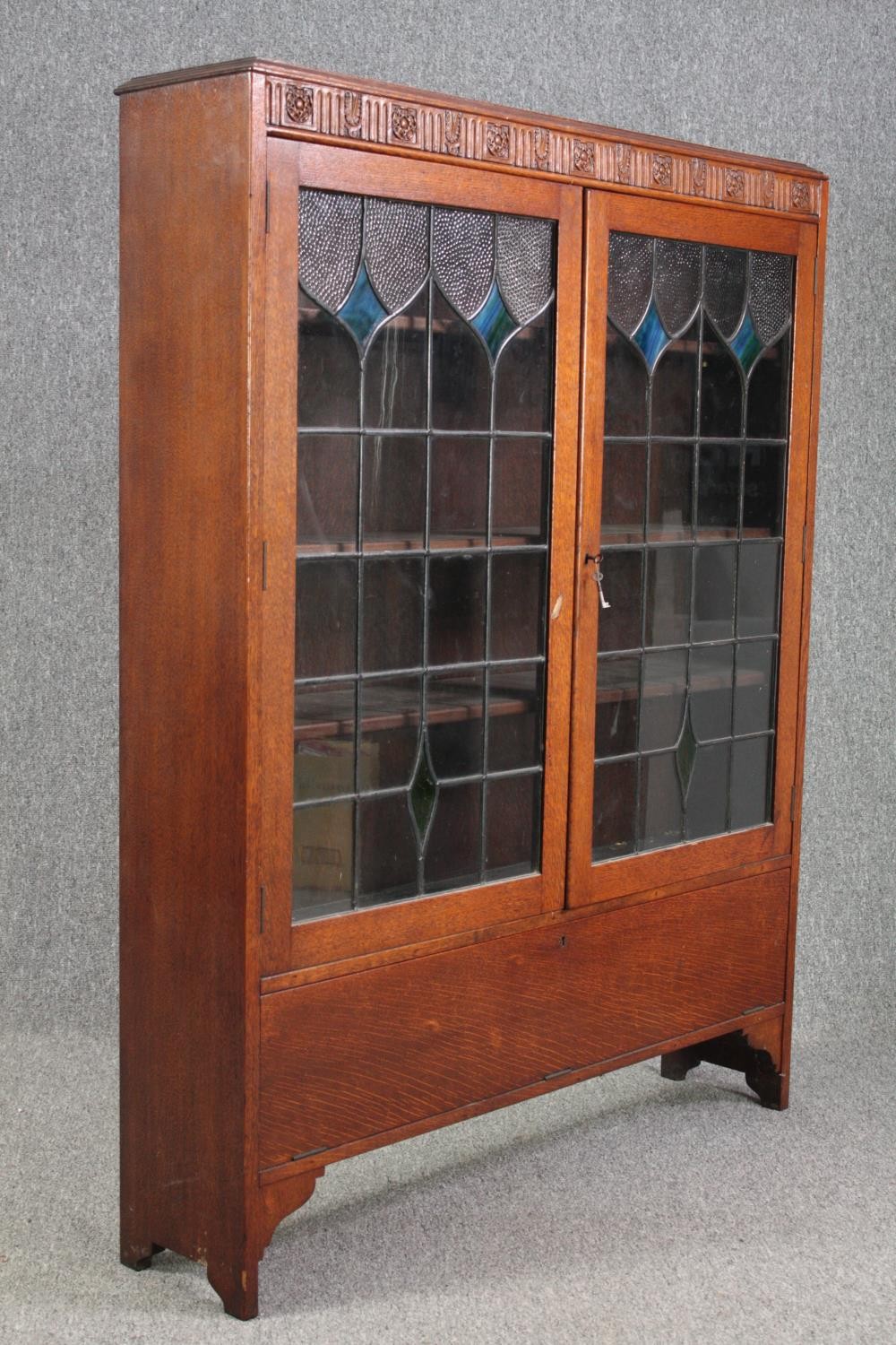Bookcase, mid century oak with leaded and coloured glass doors. H.137 W.107 D.24cm. - Image 3 of 8
